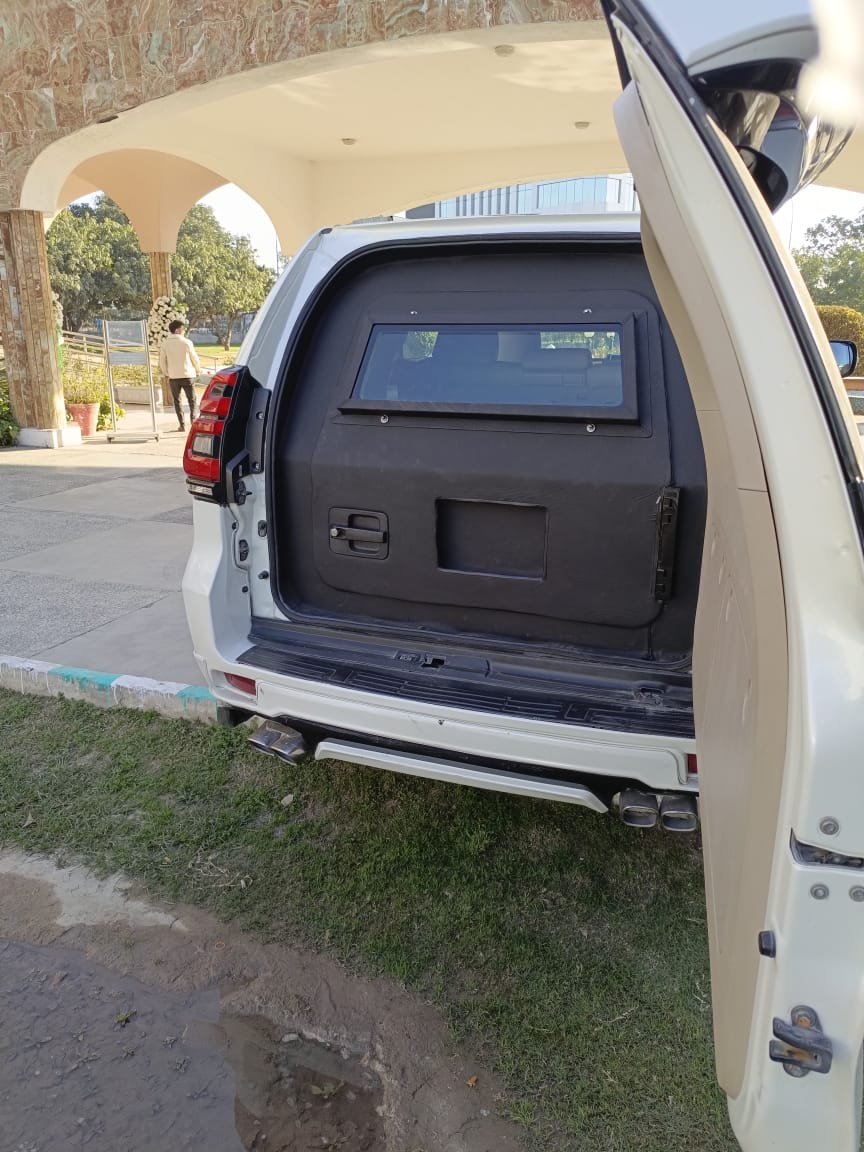 Armored Toyota Land Cruiser Prado TX, rear view, boot open showing reinforced glass